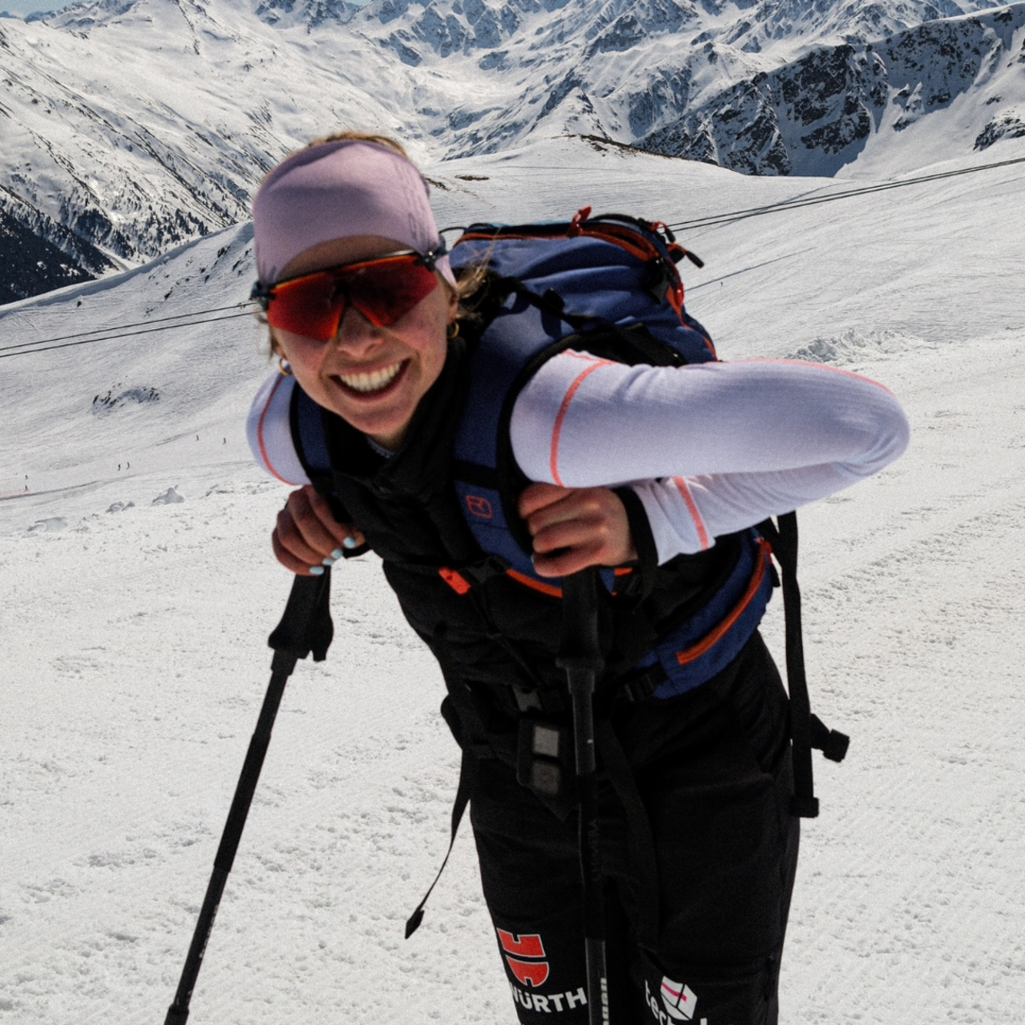 Biathlete Johanna Puff smiles at the camera during training