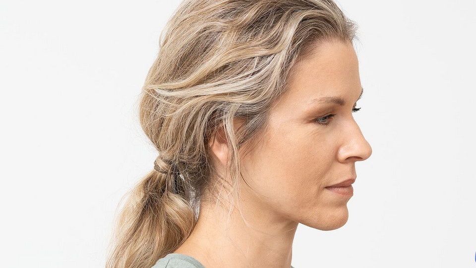 Young woman breathes relaxed