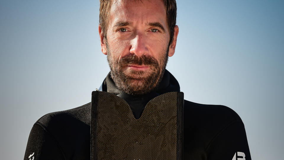 Medium close-up of Nik Linder in a diving suit