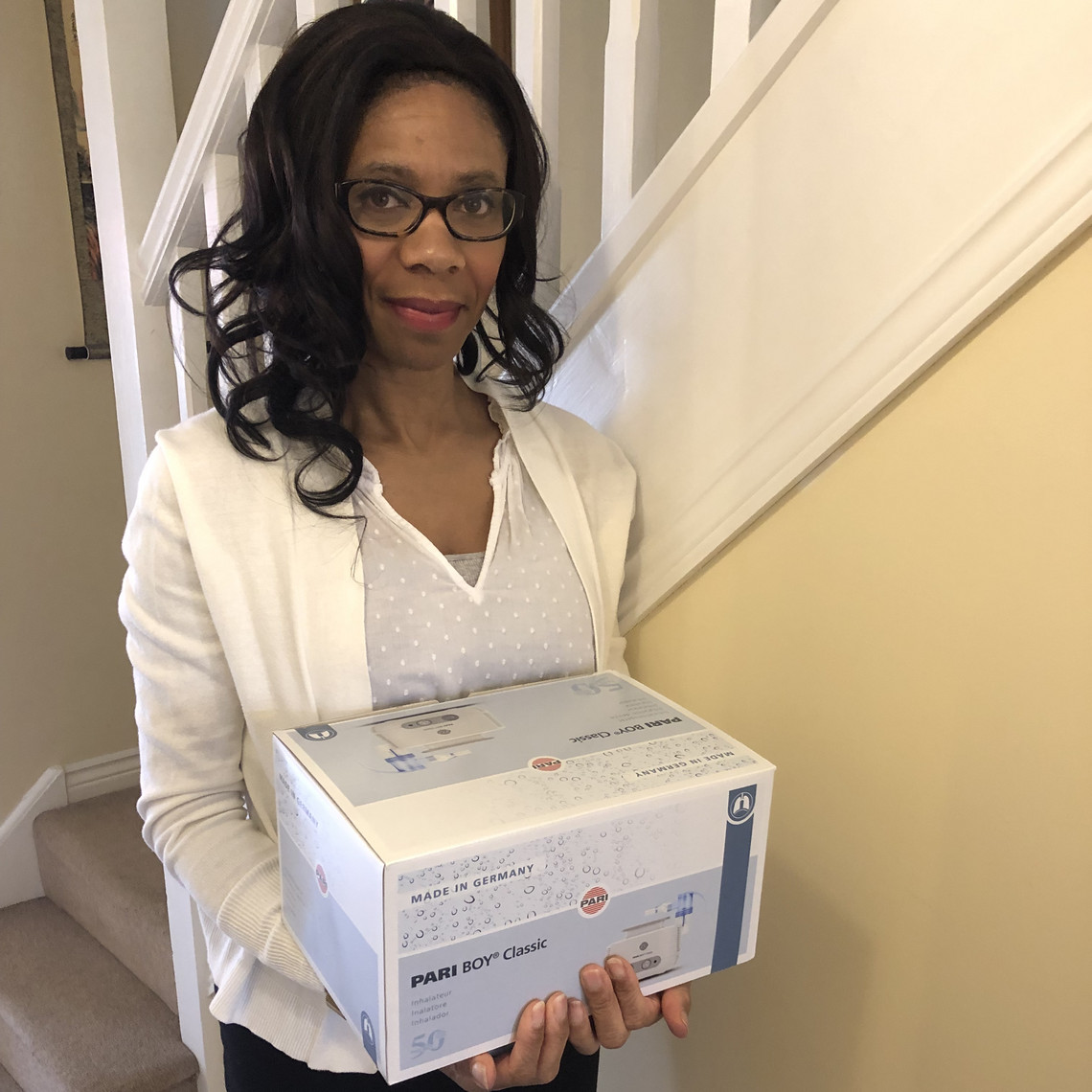 Asthma Relief: Patricia Davis Woman holding a PARI inhalation device package
