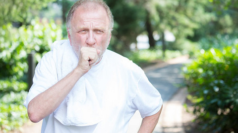 Older jogger coughing