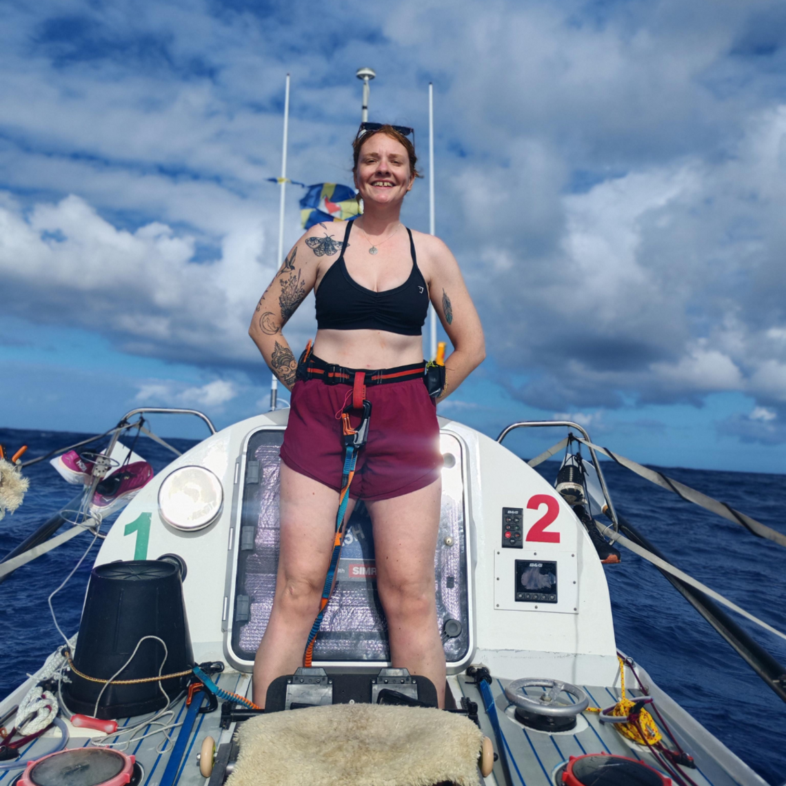 Young woman is standing on a boat