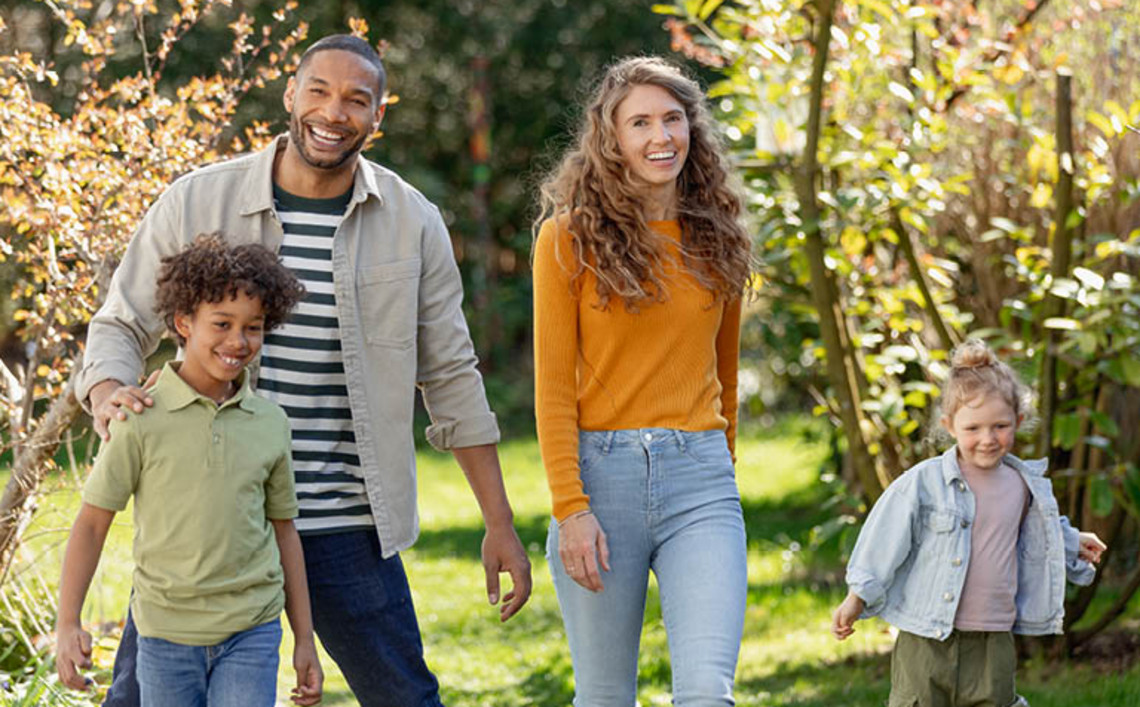 Group of people walking together outdoors in a park