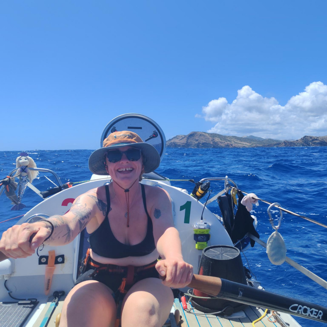 Young woman is rowing a boat
