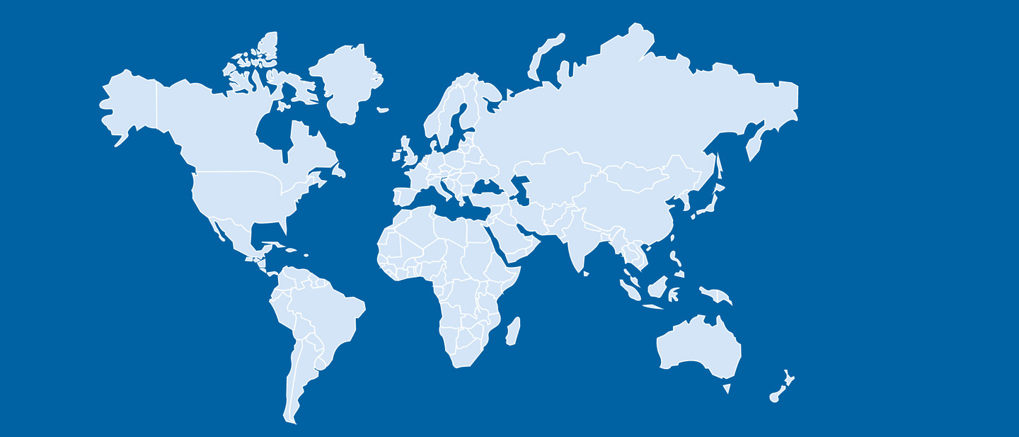 A light-coloured world map showing simplified outlines of the continents on a blue background.