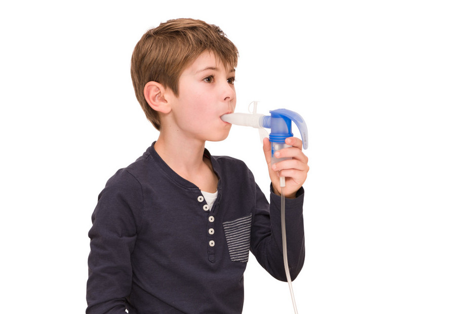 Boy inhales with the PARI LC SPRINT nebuliser and the PARI PEP S instead of a mouthpiece
