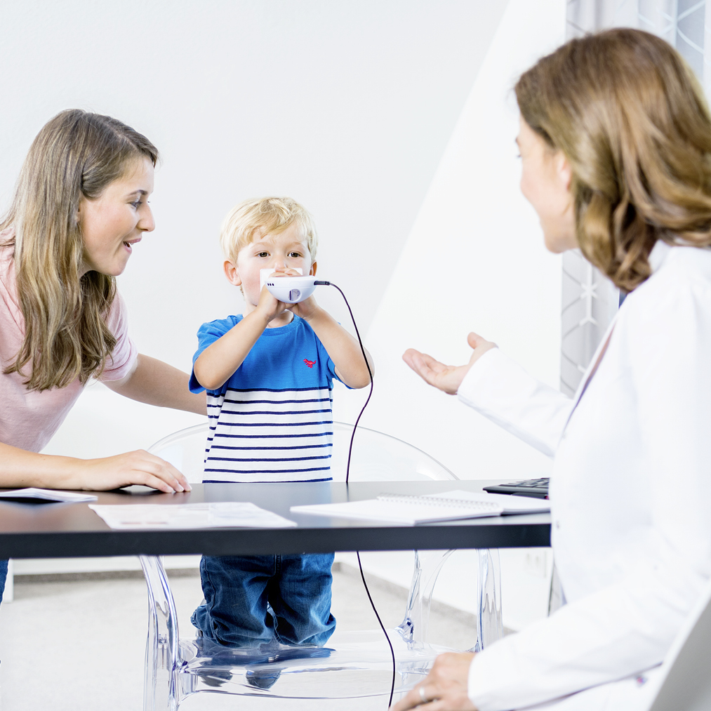 Young-mother-with-boy-at-Doctors-Office-testing-SpriroSense-Pro-2.jpg