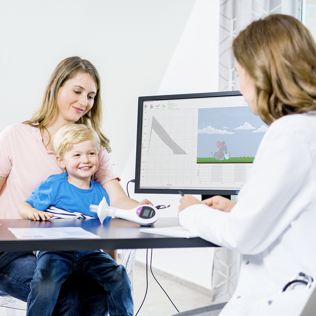 Young-mother-with-boy-at-Doctors-Office-testing-SpriroSense-Pro.jpg