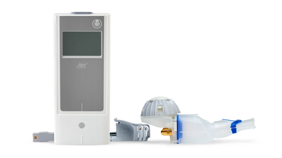 A disassembled white and gray medical device with a screen is on a white background.