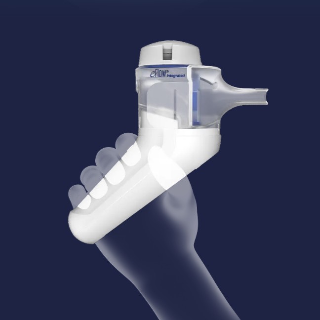 A hand holds a white and gray eFlow Integrated inhaler against a dark blue background.